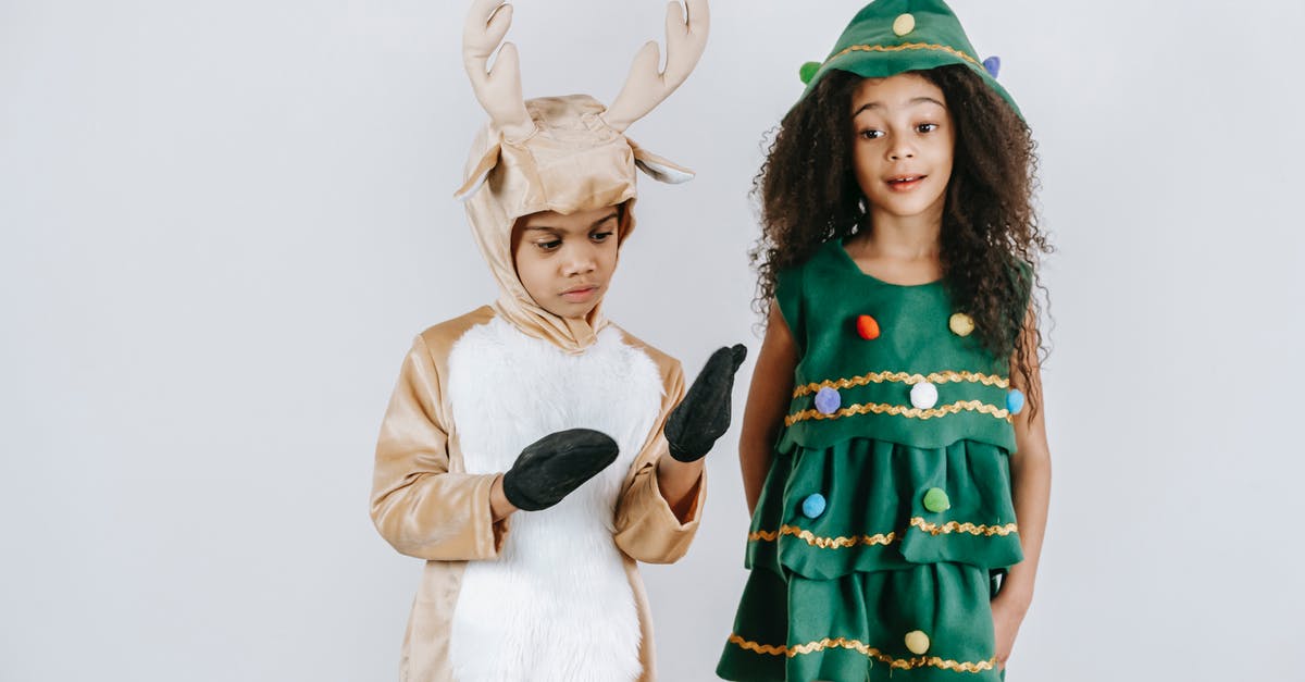 How many years have passed between season 5 and 6 of The Americans - Adorable African American boy in deer costume and girl in Christmas tree dress standing together against white wall in studio