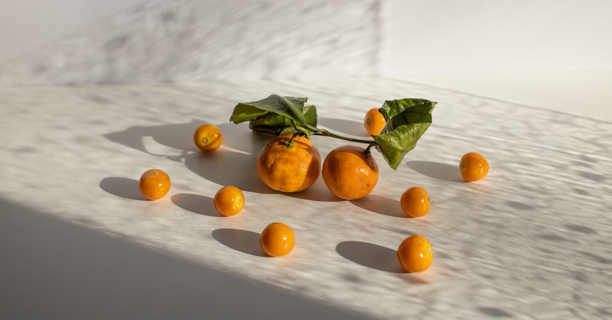How much Cantonese and Mandarin is in Everything Everywhere all at Once? - Healthy tangerines and groundcherries scattered on white surface in daylight