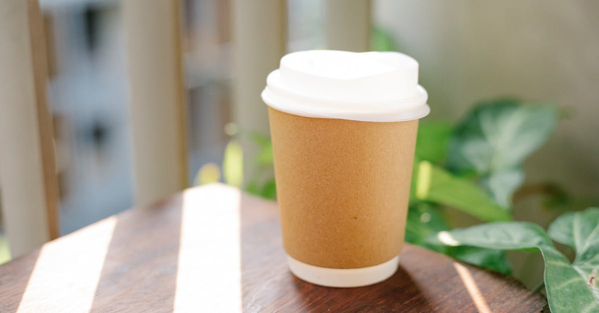 How much he is going to serve in prison for his crime? - Paper cup of coffee to go placed on table in cafeteria in sunny morning