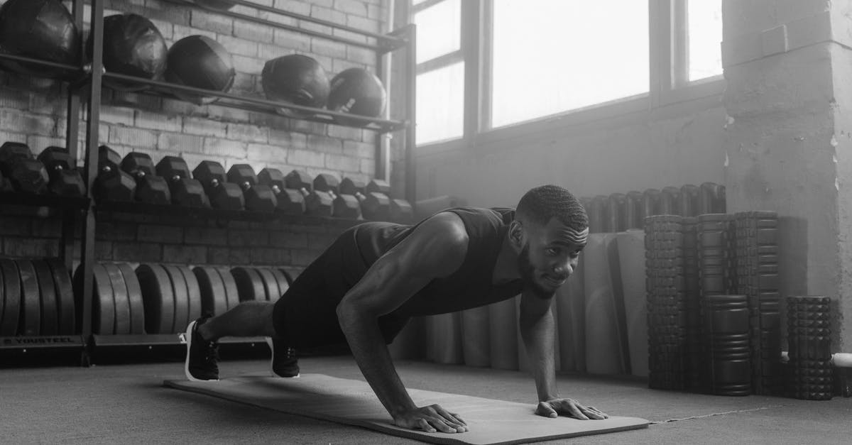 How strong are Jessica and Luke? - A Grayscale Photo of a Man Doing Push Ups