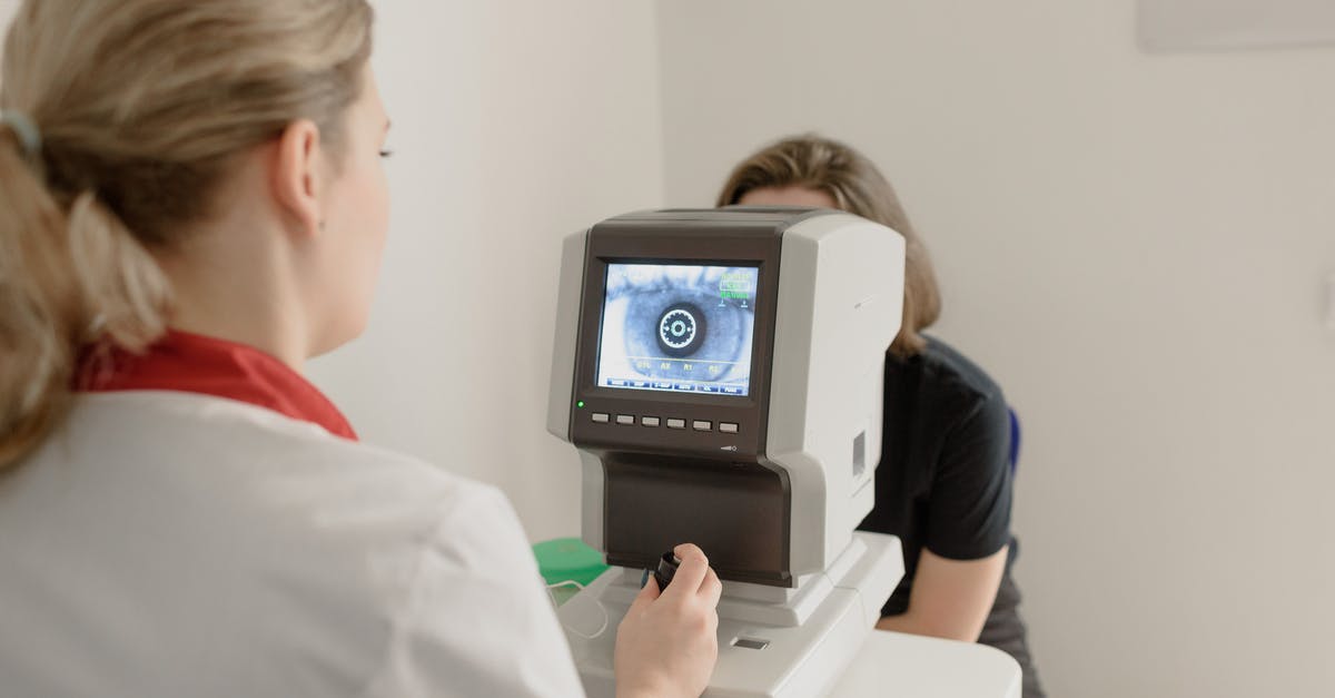 How was a retinal scan possible when the subject had closed eyes? - Anonymous oculist examining vision of patient on eye screener