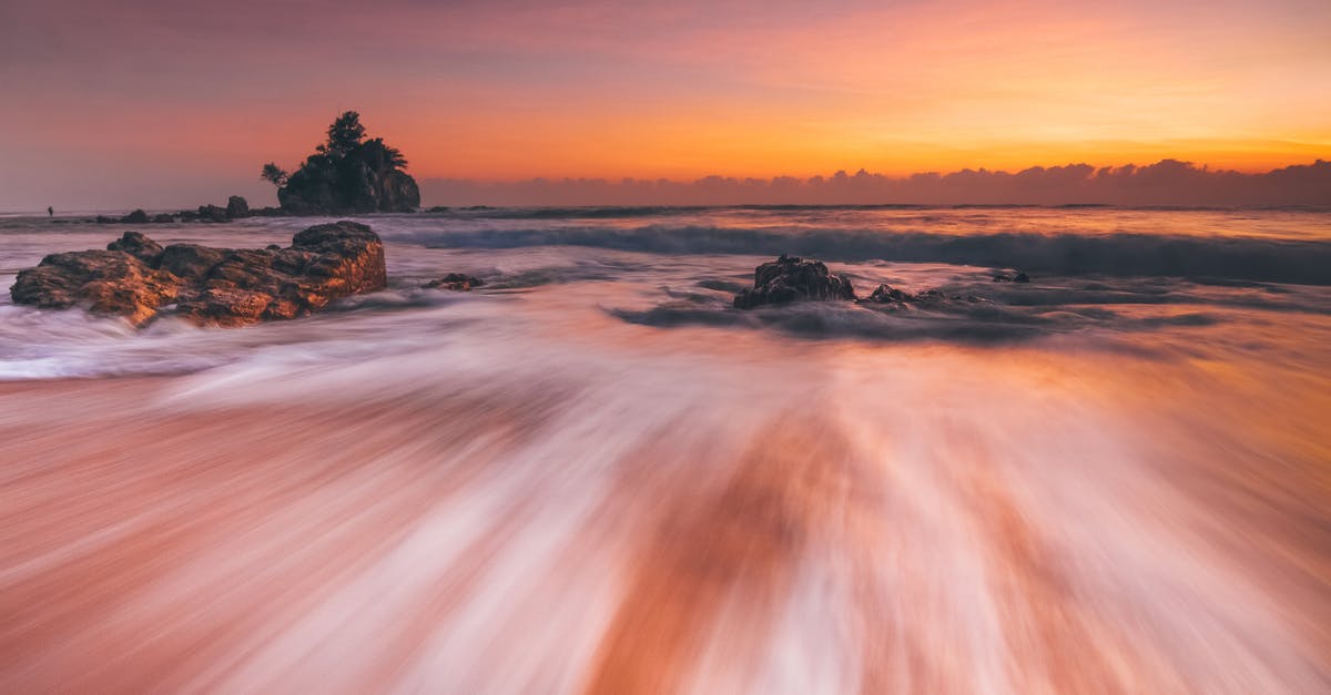 How was Stormbreaker able to withstand the power of an Infinity Stone? - Stormy sea with fast water flow on beach at sunset