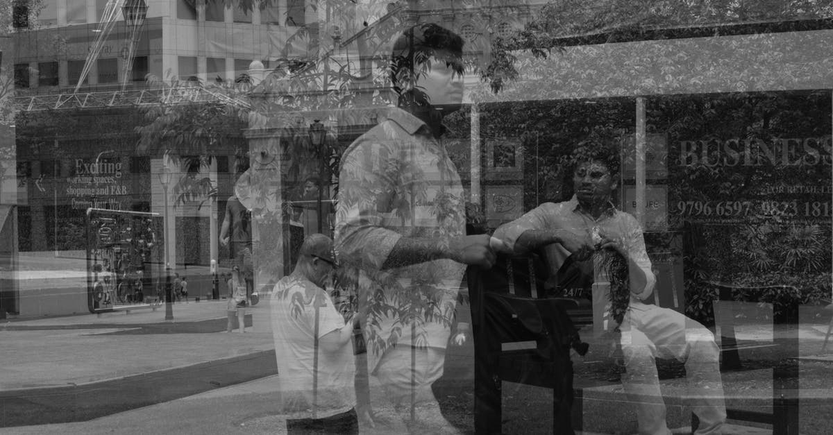 How was the three-breast effect done for the prostitute? - Man Walking Holding Backpack and Sitting on Bench Reflection on Glass