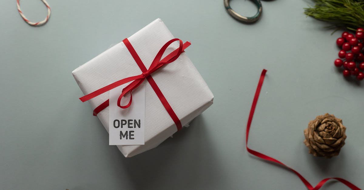 How was this opening title sequence from Atkinson's Maigret made? - Top view of present box with Open Me inscription on tag and ribbon bow near pine cones on light background