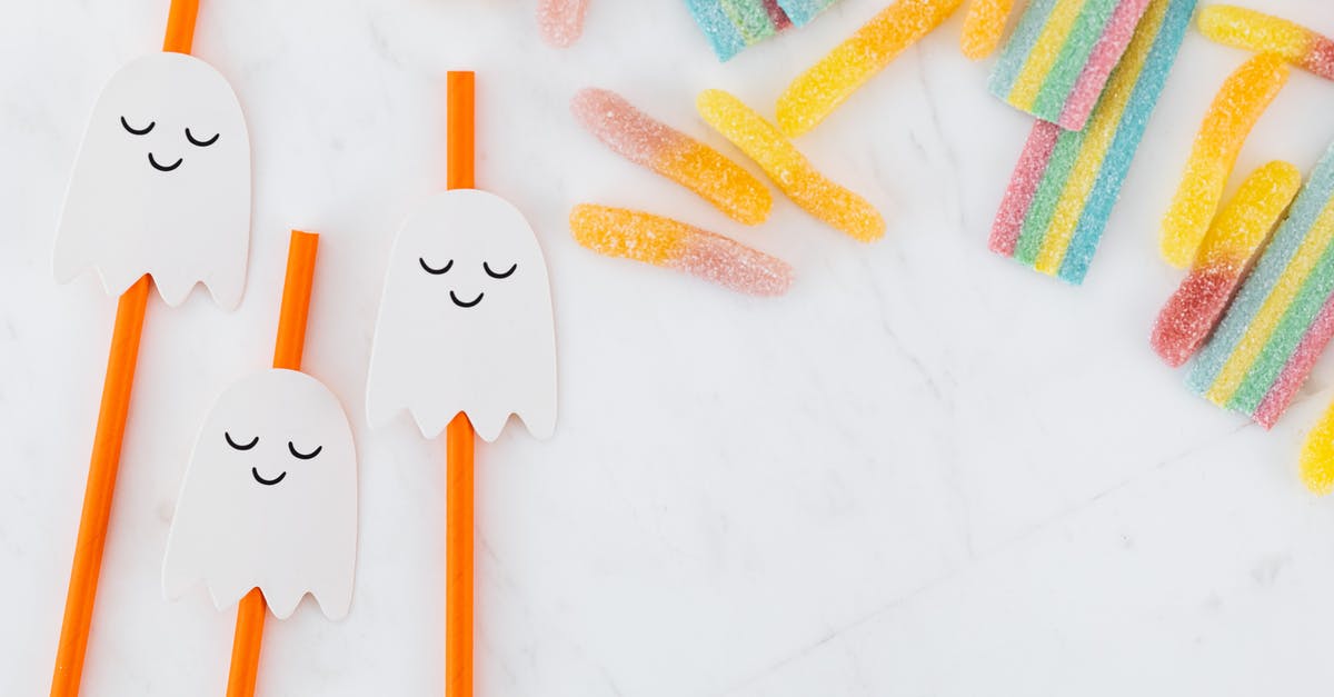 How were all of the ghosts "caught" in the movie Thirteen Ghosts? - Orange Straws with Ghost Decorations and Colorful Jelly Candy 