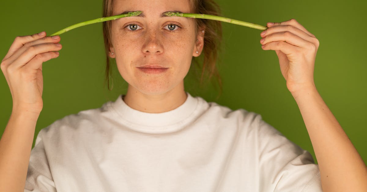 If Parker was possessing Josh throughout the whole movie, why didn't he just kill Josh's family? - Crop woman with fresh asparagus stems on green background