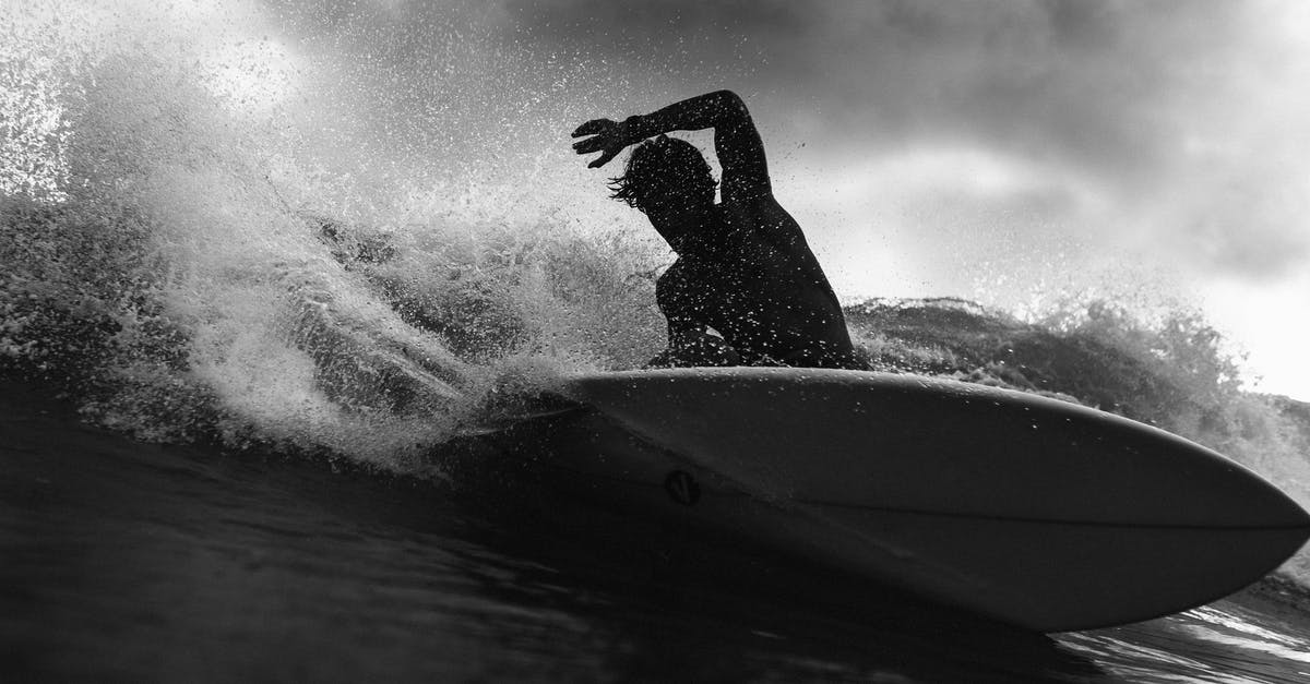 In Breaking Bad season one, A No-Rough-Stuff-Type Deal, why don't they roll the barrels? - Black and white of anonymous male surfer riding on wave with raised arm against cloudy sky in stormy weather outside