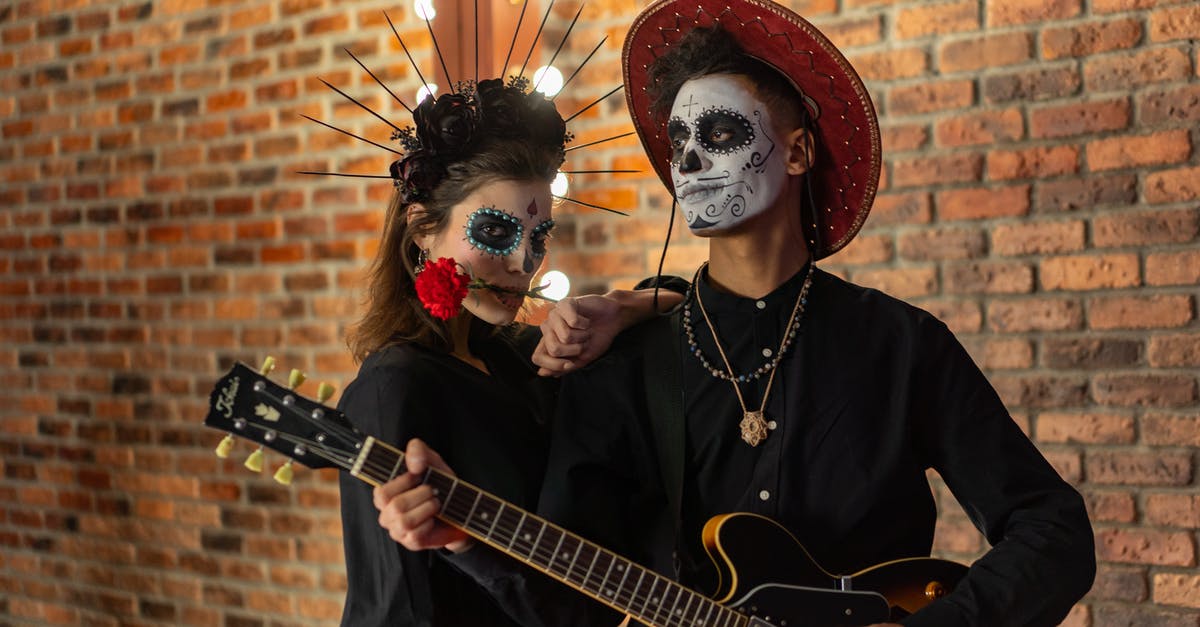 In Doctor Sleep, why can ghosts overpower Rose the Hat? - Photo of a Man Playing a Guitar Beside a Woman with a Rose