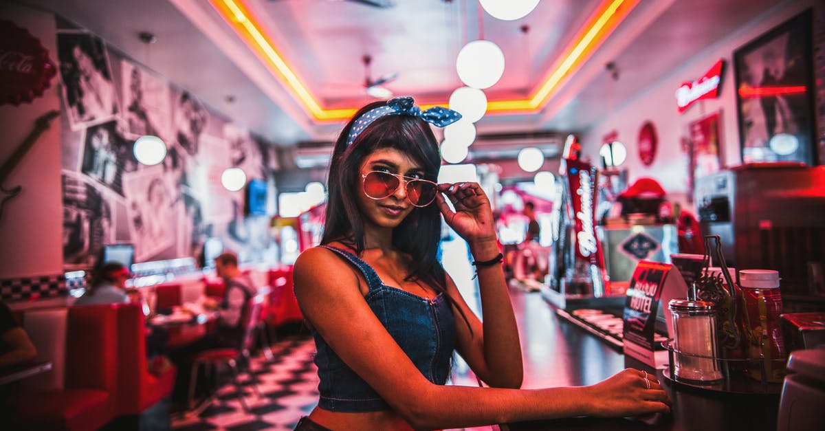 In San Junipero, is there any significance as to why the bar is named Tucker's? - Woman Lowers Her Sunglasses
