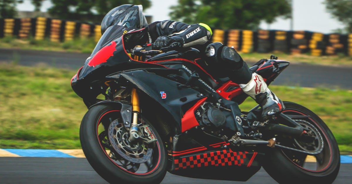 Inspiration for making Speed Racer - Man With Black Alpinestar Racing Suit Riding Black and Red Sports Bike