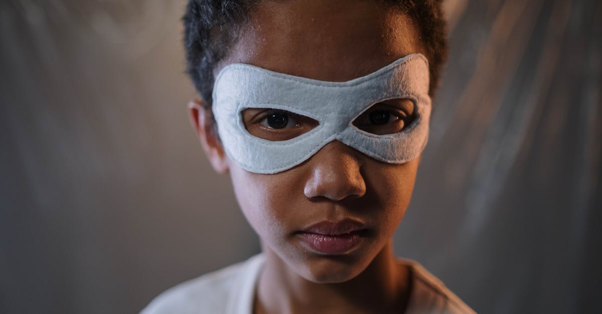 Is any superhero in The Boys parodying a Marvel superhero? - A Boy Wearing a White Mask in Close-up Shot
