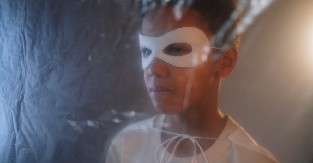 Is any superhero in The Boys parodying a Marvel superhero? - A Boy Wearing a Mask Behind a Plastic Curtain