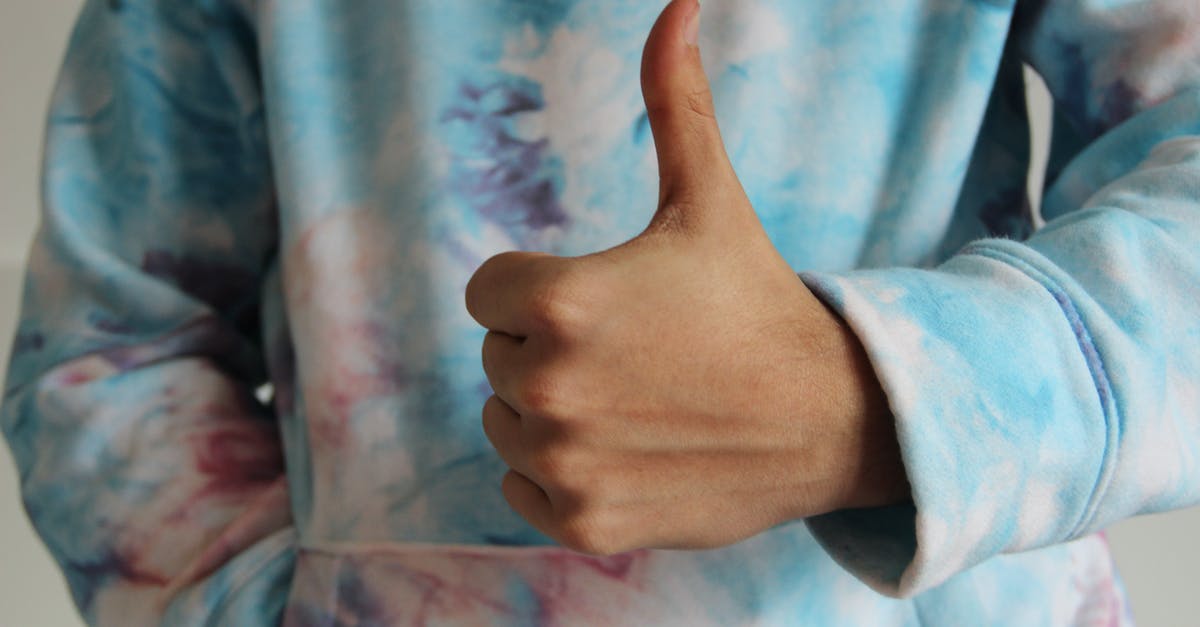 Is Buzz Lightyear forgetting his origins like Woody? - A Person in Tie Dye Sweater Doing Thumbs Up