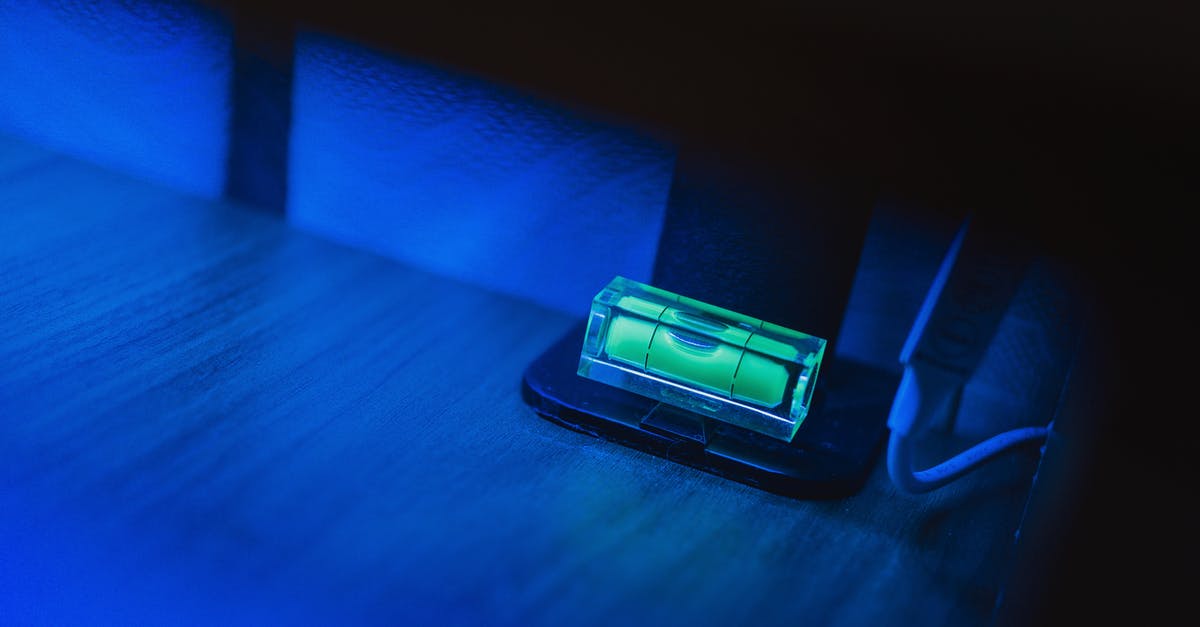 Is Collier's line about the bible correct? - Small illuminating green neon bubble level placed on monitor stand in dark room