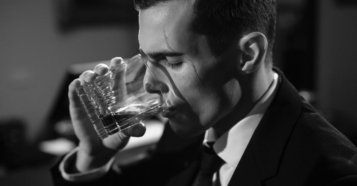 Is it easier to make an older actor look younger than a younger actor older? - Close-Up Photo of Man Drinking Whiskey