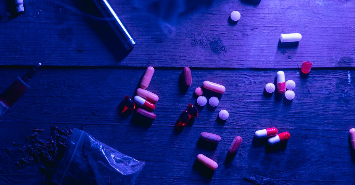 Is it illegal to make a video jukebox? [closed] - Red and White Medication Pill on Black Wooden Table