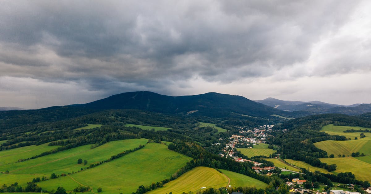 Is it known in which fields Sheldon Cooper's two doctorates and one master's degree are? - Aerial Photo of A Town And Its Surrounding Landscape Under Cloudy Sky