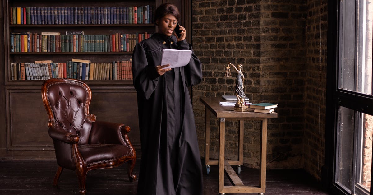 Is Judge Dredd a psychic himself? - Woman in Black Dress Standing Beside Brown Wooden Table
