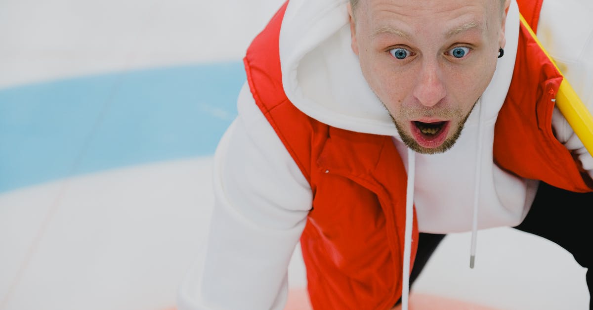 Is Nerve an AI? - Amazed man in sportswear with opened mouth and broom playing curling on ice sheet with circular target area during game in playing area