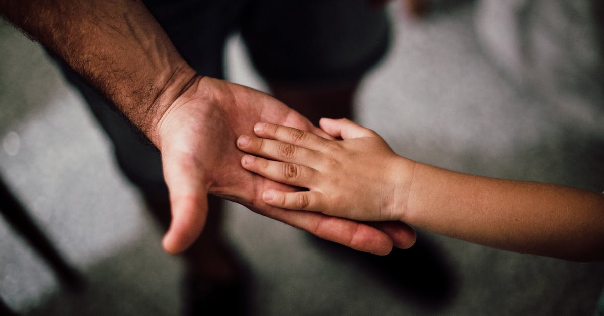 Is Noah Tronte Neilson's father? - Selective Focus Photography of Child's Hand