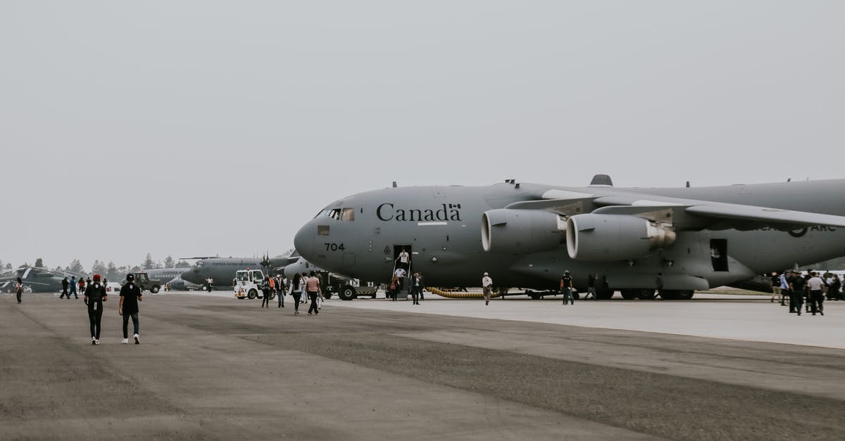 Is Saddam Hussein Canadian or Danish? - Canadian C-17 Transport Plane Standing on Tarmac