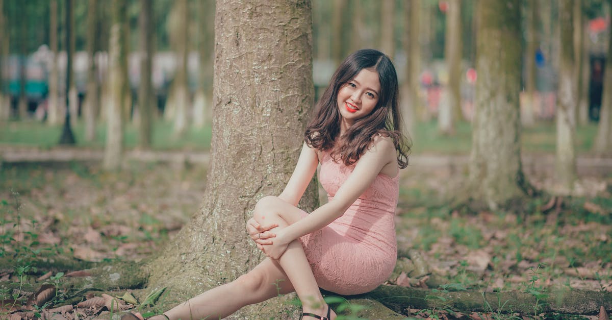 Is Slim actually visible when stuck in the tree? - Woman Wearing Pink Sleeveless Dress