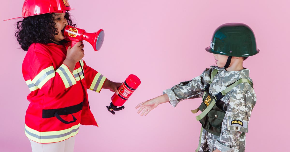 Is the kid a reference to another Marvel hero? - Side view of multiracial children in military uniform and fireman costume with megaphone and fire extinguisher standing together on pink background in helmets