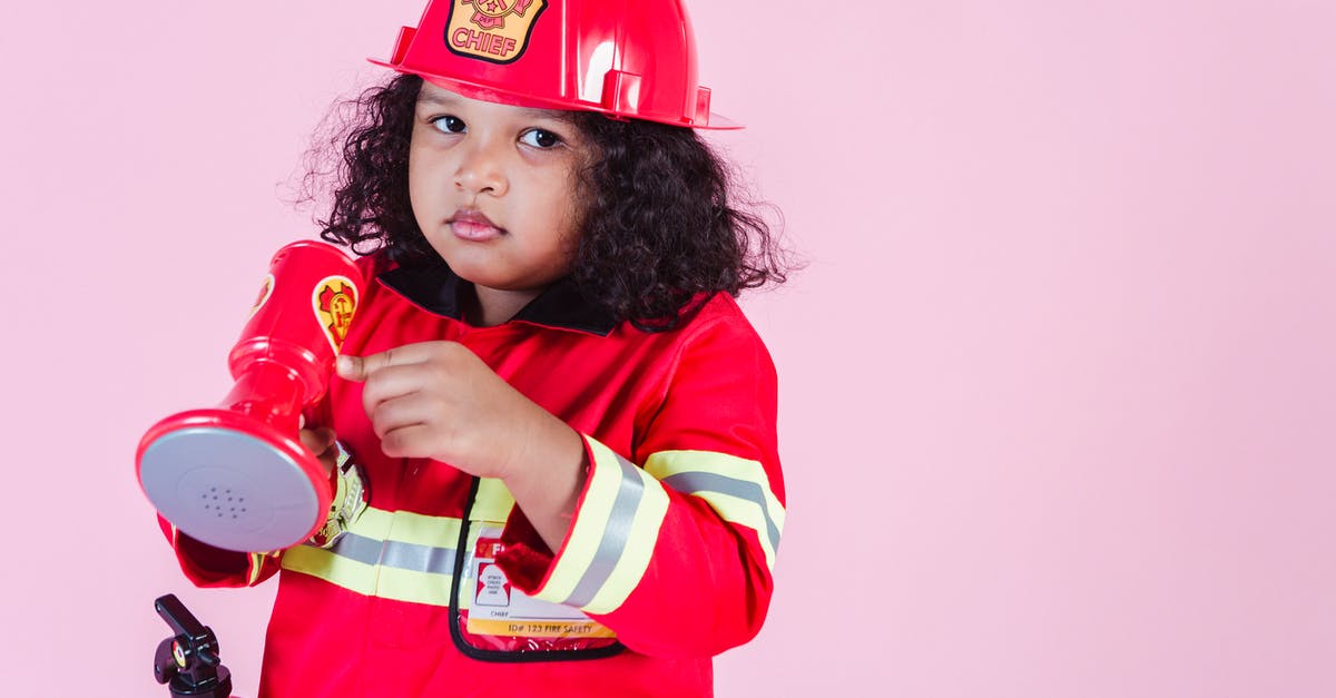 Is the kid a reference to another Marvel hero? - Ethnic girl in firefighter costume in studio