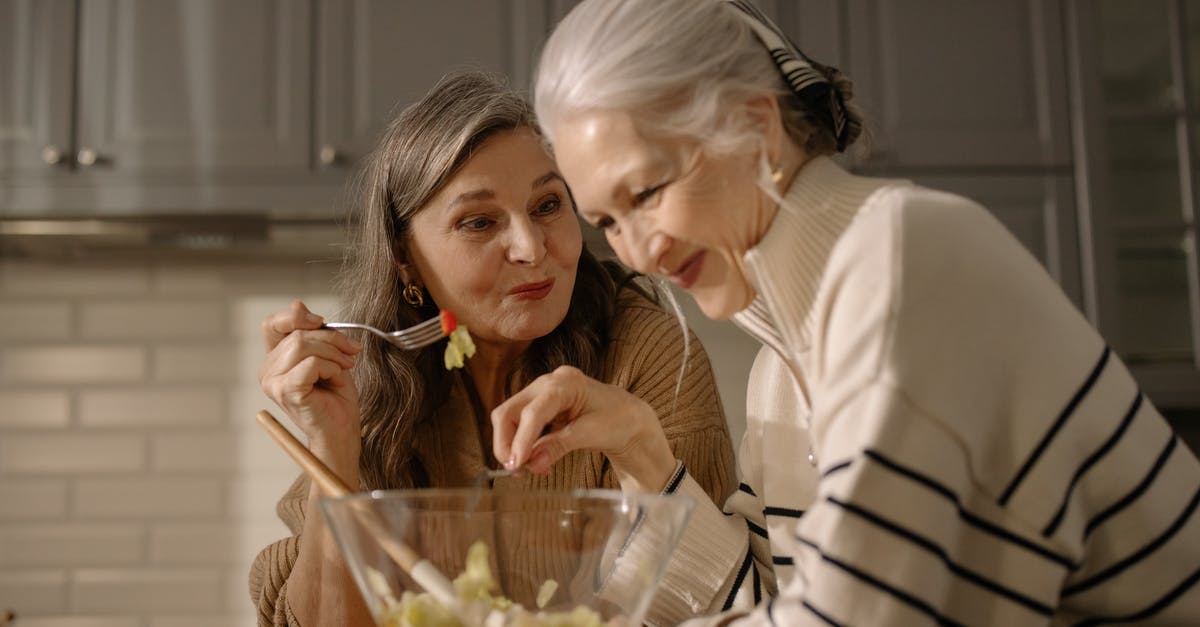 Is the "low talker" actually talking or just mumbling nonsense? - An Elderly Women Eating Salad in the Kitchen