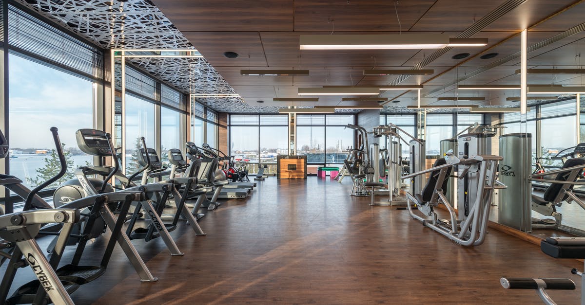 Is there a name for Robin Williams' style of physical comedy? - Interior of modern spacious fitness club with various sports machines and equipment placed on parquet floor near panoramic windows