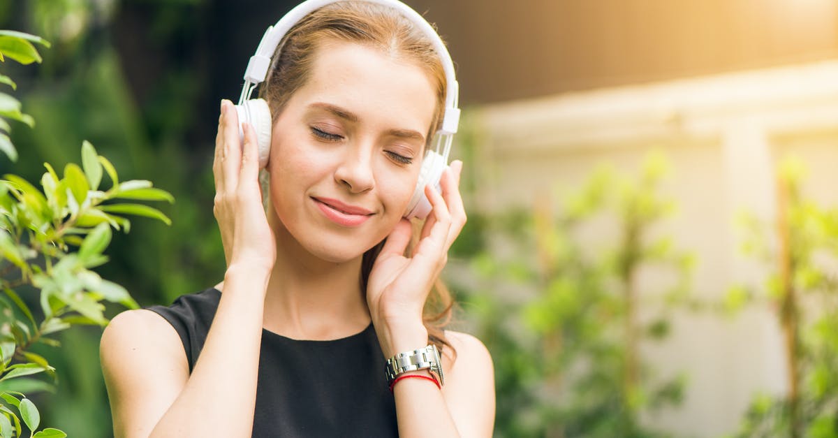 Is there a pattern to scenes where Baby isn't listening to music but there's no tinnitus sound? - Woman Wearing Black Sleeveless Dress Holding White Headphone at Daytime