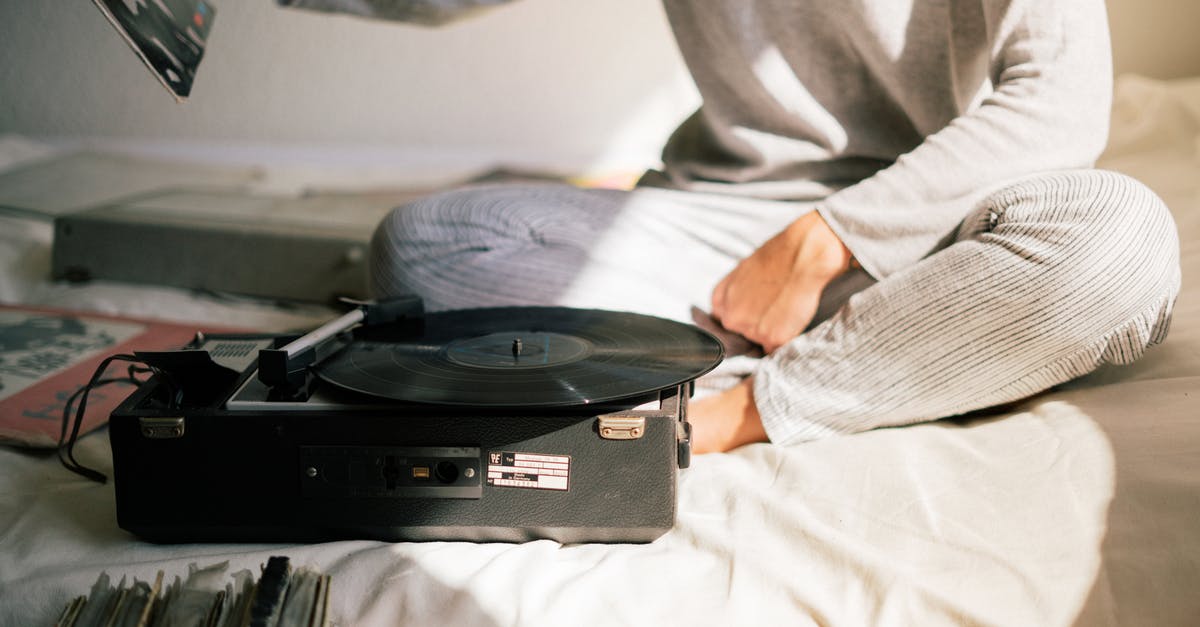 Is there a pattern to scenes where Baby isn't listening to music but there's no tinnitus sound? - Person in Gray Sweater Holding Black Vinyl Record Player