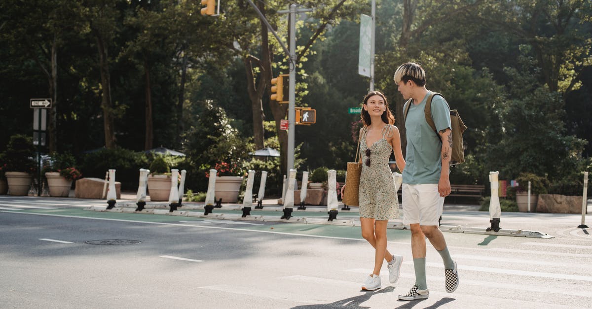 Is there any way in which to use cross-over characters from other TV series? - Full body of happy young girlfriend carrying bag while walking on asphalt crosswalk with boyfriend