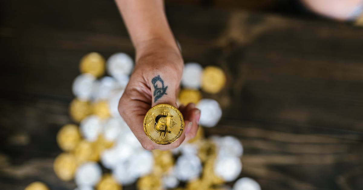 Is this an homage to Trading Places? - Person Holding Gold Round Coins