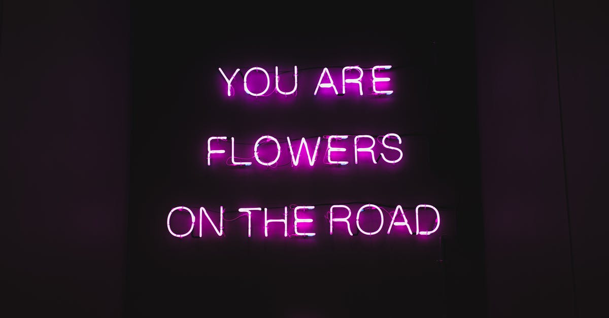 Is this phrase uttered by Roland Blum a reference to Braindead? - Pink color neon luminous text with inspiring phrase You are flowers on the road on black signage at night