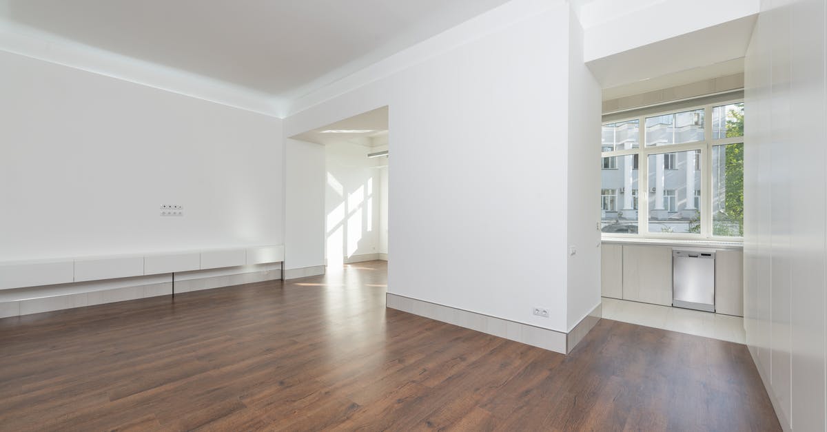 Is this thing a wight or a White Walker? - White Wooden Cabinet on Brown Wooden Parquet Floor