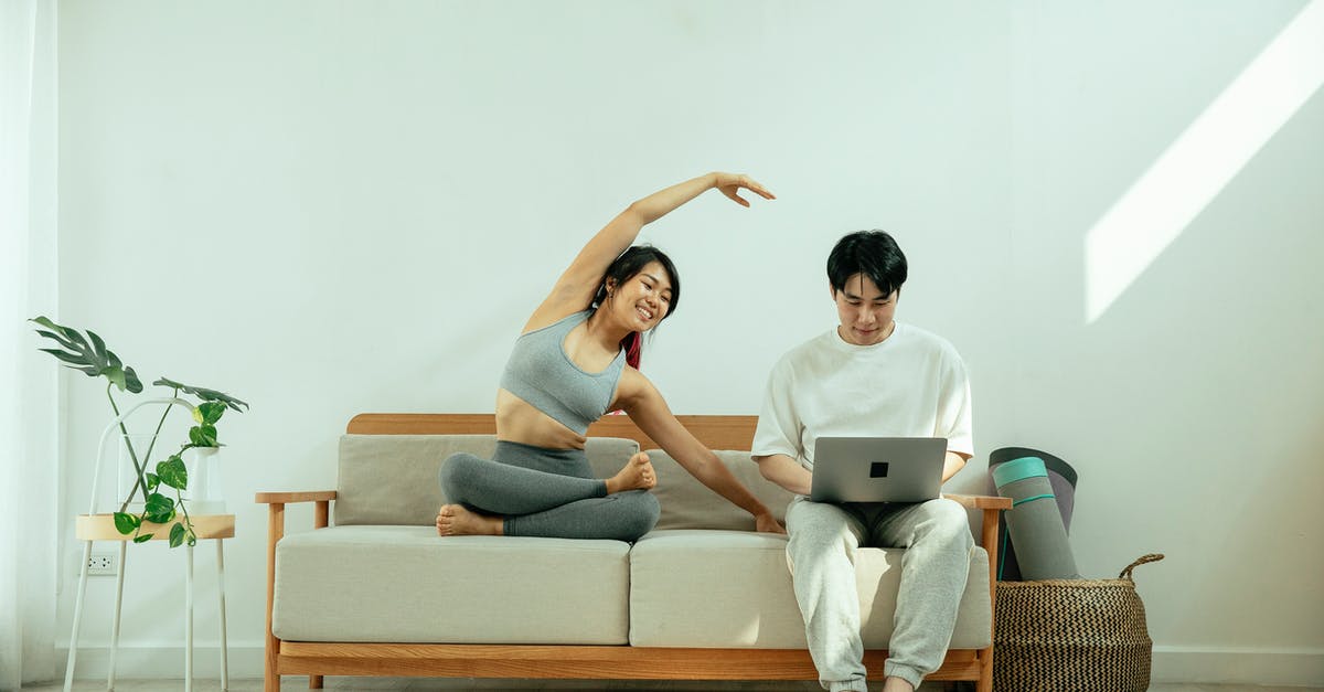 Is Yoda made using CGI in the original Star Wars or is it practical effects? - Full body of Asian male using laptop while happy female stretching body on sofa in light living room