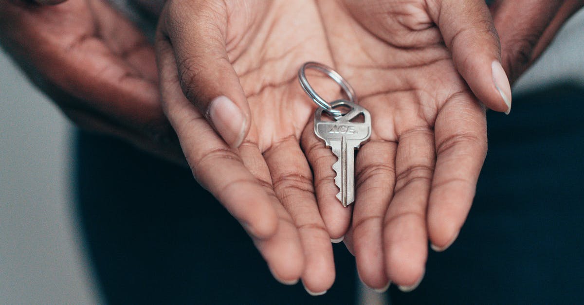 Keys to Monika's apartment - Key on a Person's Palm