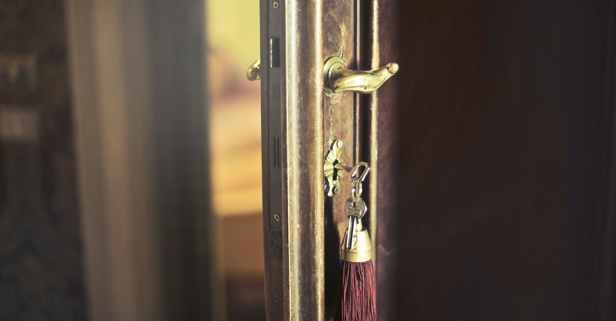 Keys to Monika's apartment - Key with trinket in shabby door