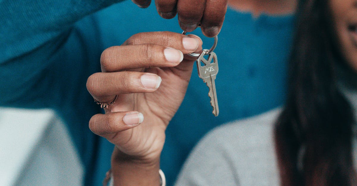 Keys to Monika's apartment - People Holding a Key