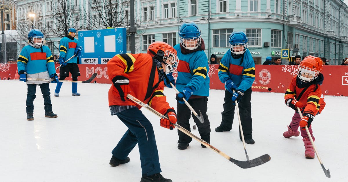 Kids in a post-apocalyptic world playing a hockey-like game [closed] - Photo of Kids Playing Hockey