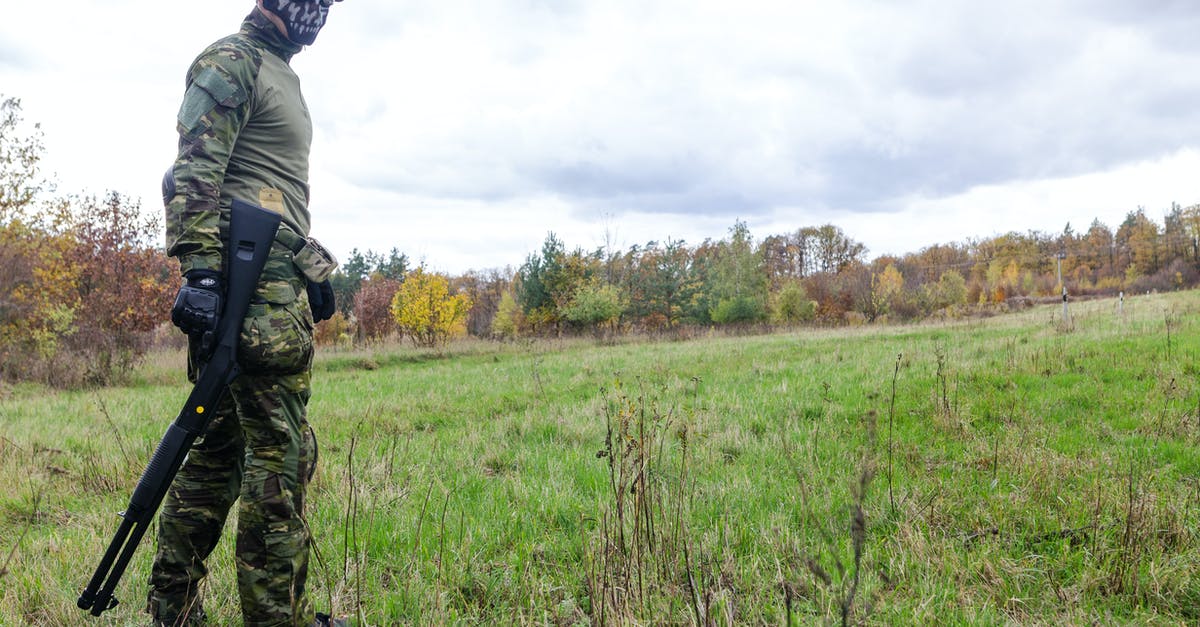 Last scene of the movie American Sniper - Photo of Man Wearing Green Combat Uniform Holding Rifle