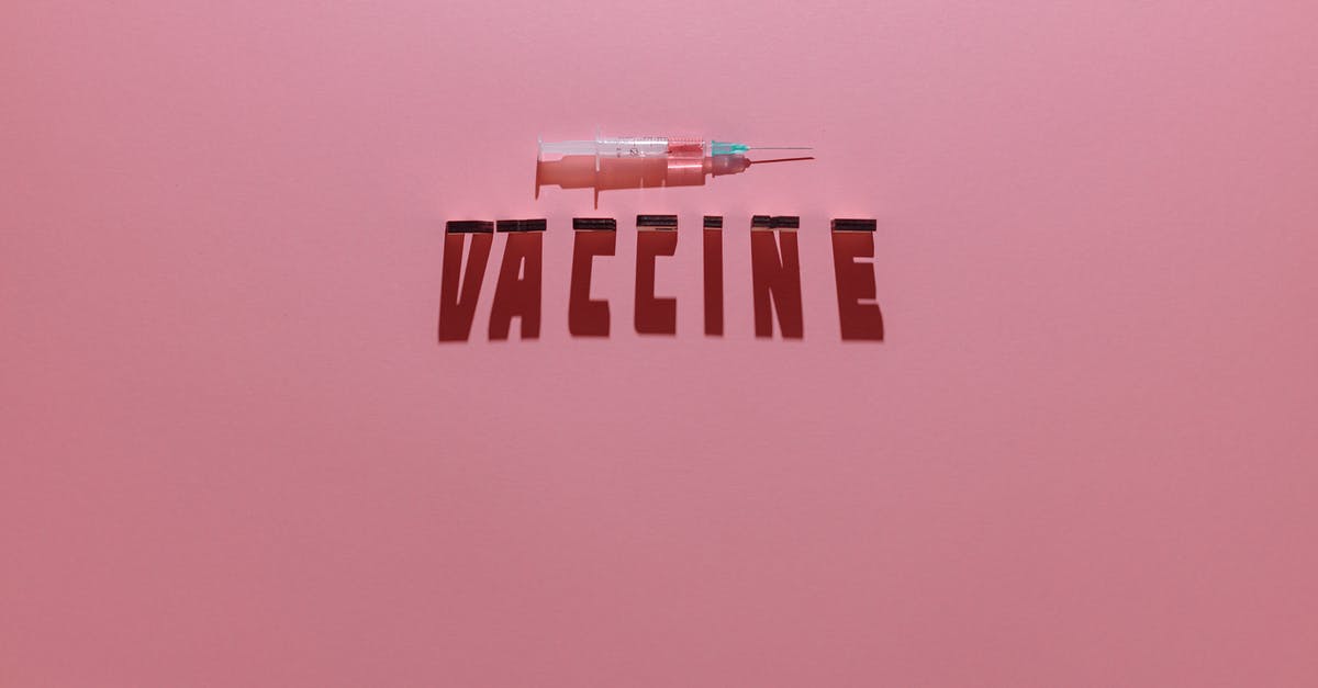 Leitmotifs in "revival era" Doctor Who - A Syringe and Vaccine Lettering Text on Pink Background
