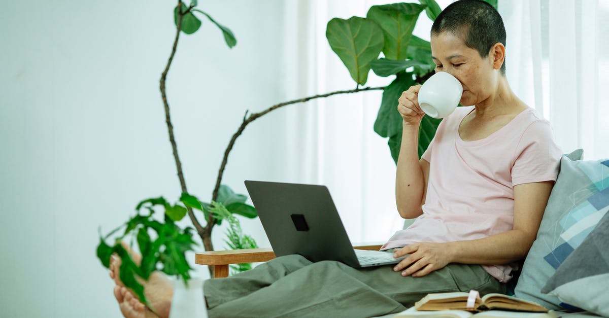 Leon "type" of plant [closed] - Asian lady using netbook on couch with cup of drink