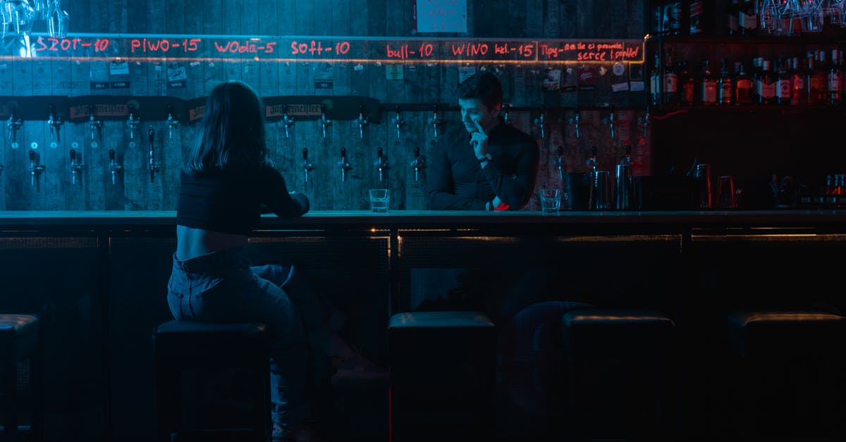Meaning of the pink soap bar in Fight Club - Man and Woman Sitting on Chair in Front of Table