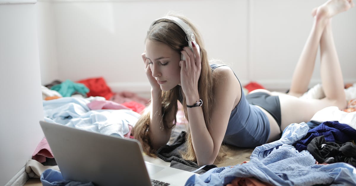 Movie about a girl who wishes or writes in a book for things to happen to people? [closed] - Young woman watching movie in headphones in messy room