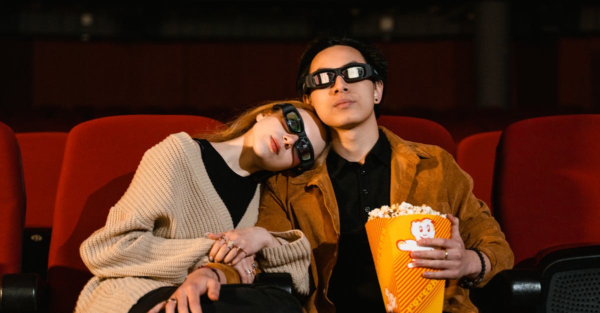 Movie where holding their breath makes people invisible [closed] - Couple with 3D Glasses and Popcorn in Yellow Tumbler