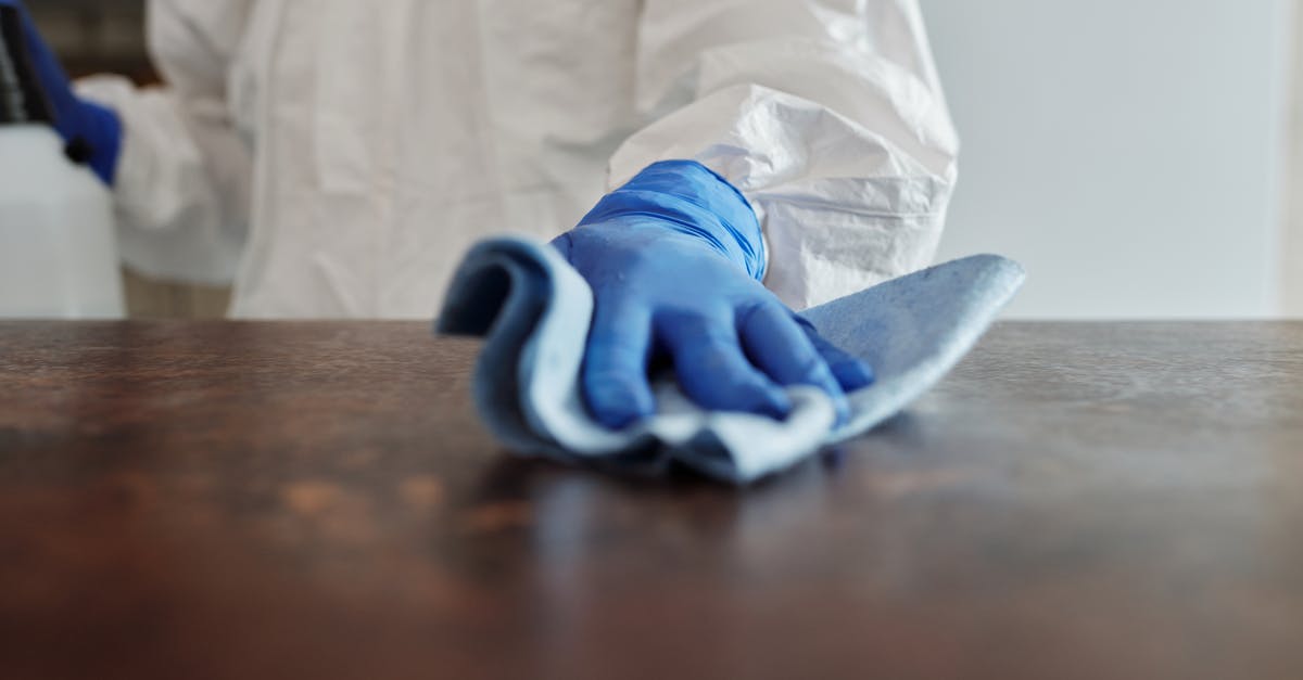 Outbreak climax explanation - Close-Up Photo Of Person Cleaning The Table