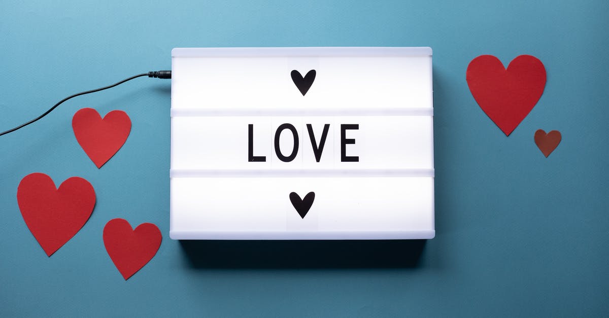 Outcome of relationship at the end of 'Blue Valentine' - Composition of light box with Love word and glued paper hearts for Saint Valentine concept