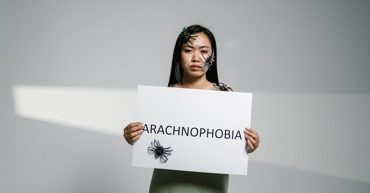 Question about spiders in Arachnophobia - A Woman Holding a Sign of Arachnophobia